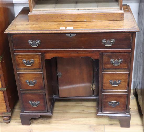 A George III style mahogany kneehole secretaire desk W.82cm